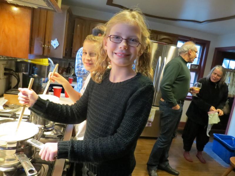 Maryam Harmon makes candy at the holiday party