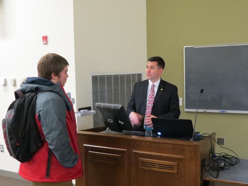 Alum DJ Hovermale talks to a student after his talk