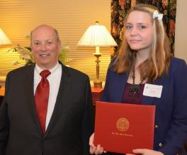 Haley Koman accepts her award