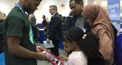 Instructor teaching kids on tablet