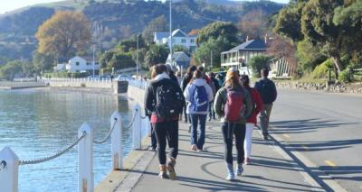 Students walking next to Water