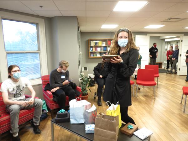 Kate Kinnaird drawing names for the gift exchange.