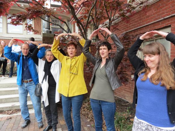 Faculty and staff make the "O" in OHIO during a bluegrass rendition of "Hang on Sloopy"