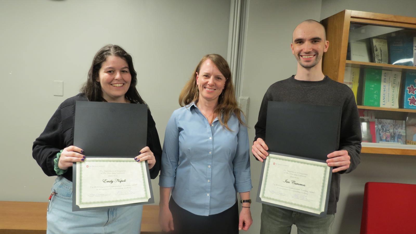 Emily Napoli and Ian Cameron pose with their TA awards with TA Coordinator Hope Dawson